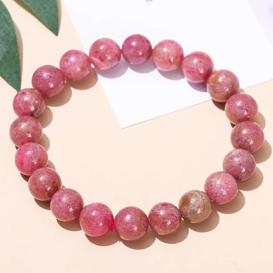 Armband av rhodokrosit